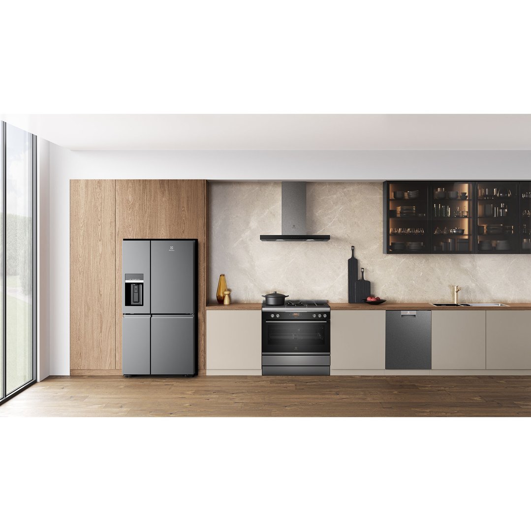 Dark stainless steel freestanding cooker in a modern kitchen with other appliances