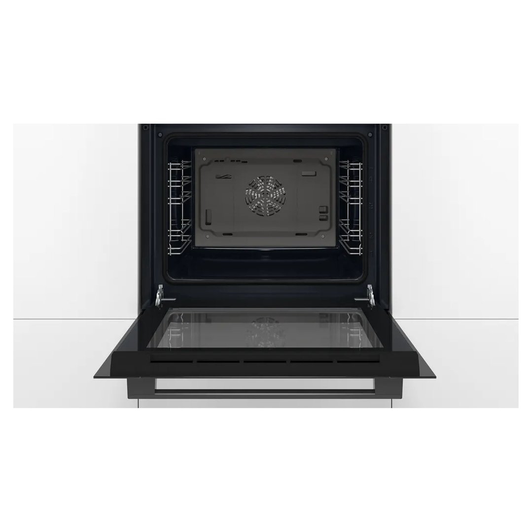Black built-in oven with the door open, showing the interior and racks
