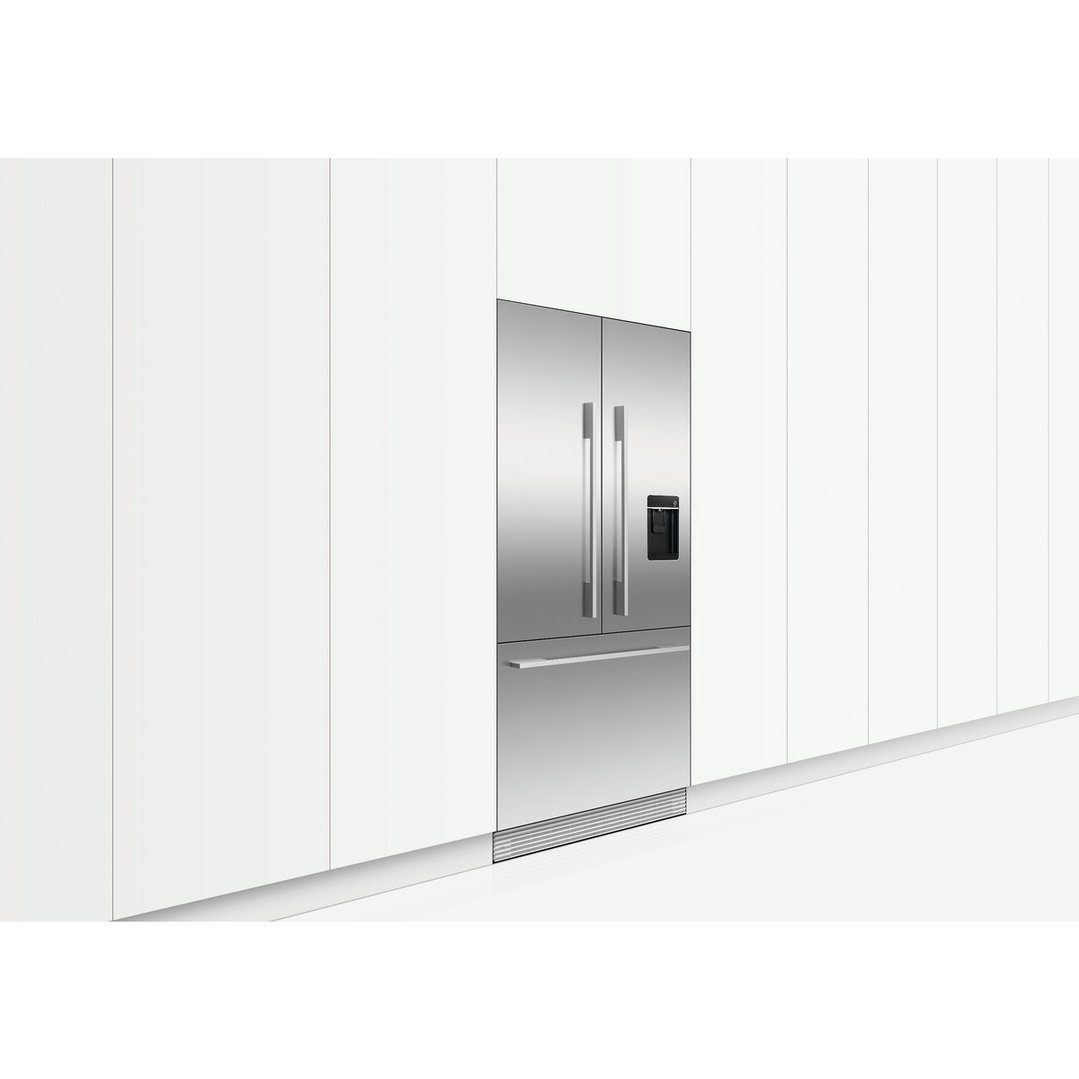 Stainless steel French door refrigerator freezer integrated into white kitchen cabinetry
