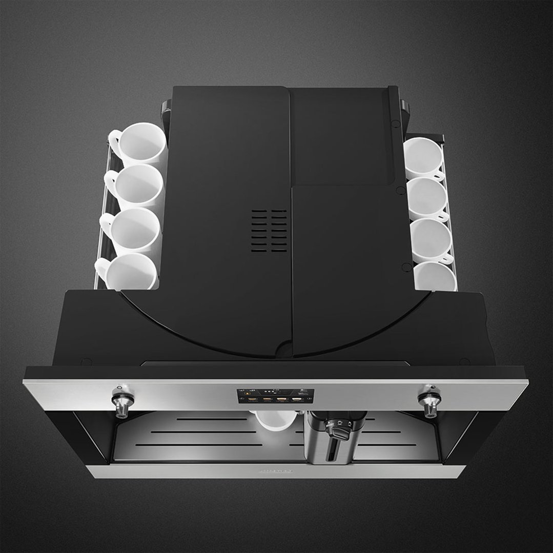 Overhead view of a built-in coffee machine with cups on either side