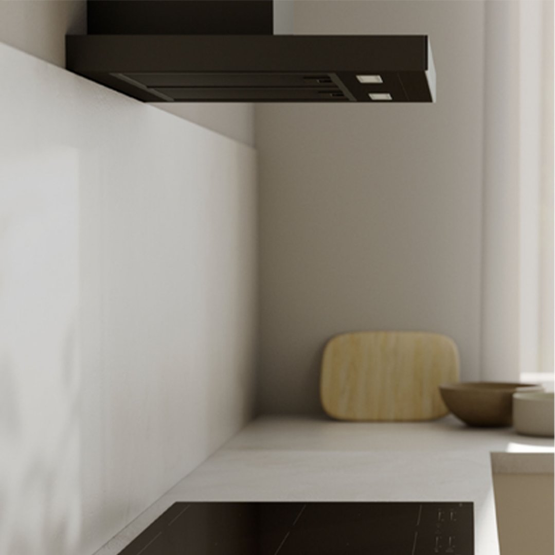 A matte black rangehood installed above a cooktop in a modern kitchen
