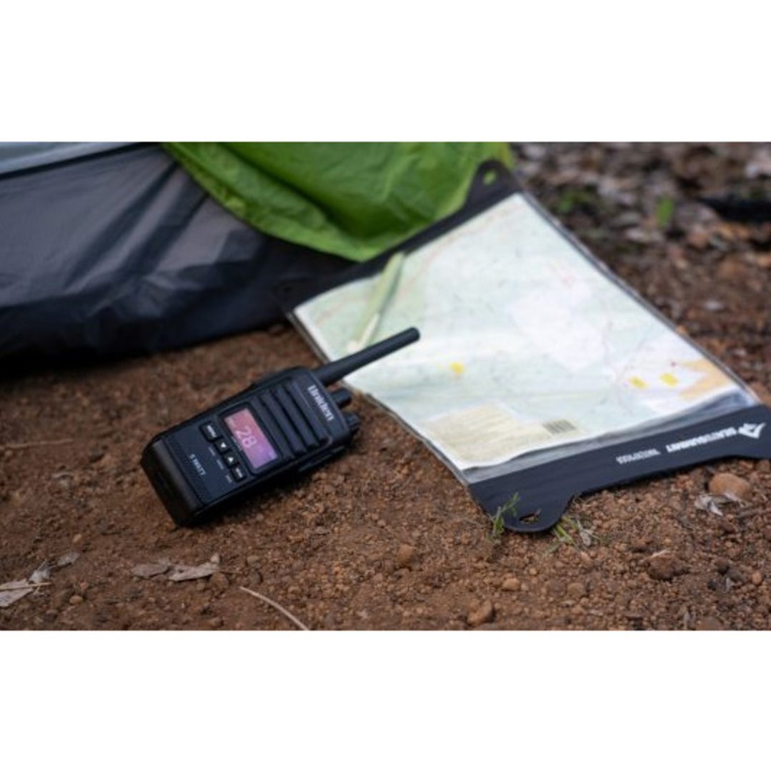 Uniden 5 Watt UHF CB Splashproof Handheld Radio and map on the ground