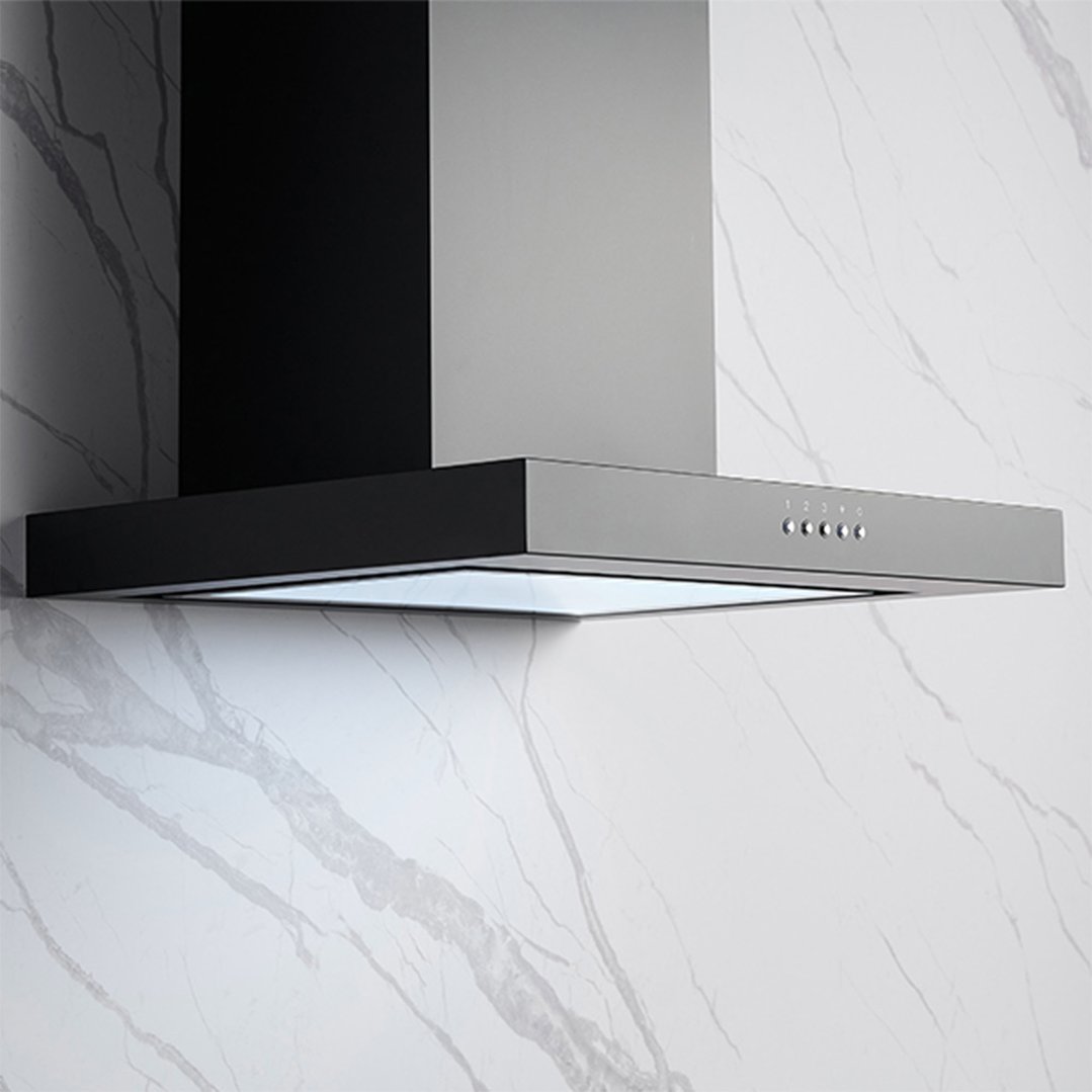 Black canopy rangehood with controls on a white marble wall