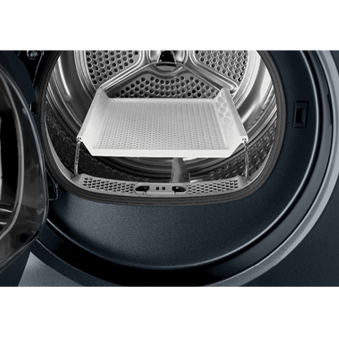 Close up of the inside of a washer dryer combo with a drying rack