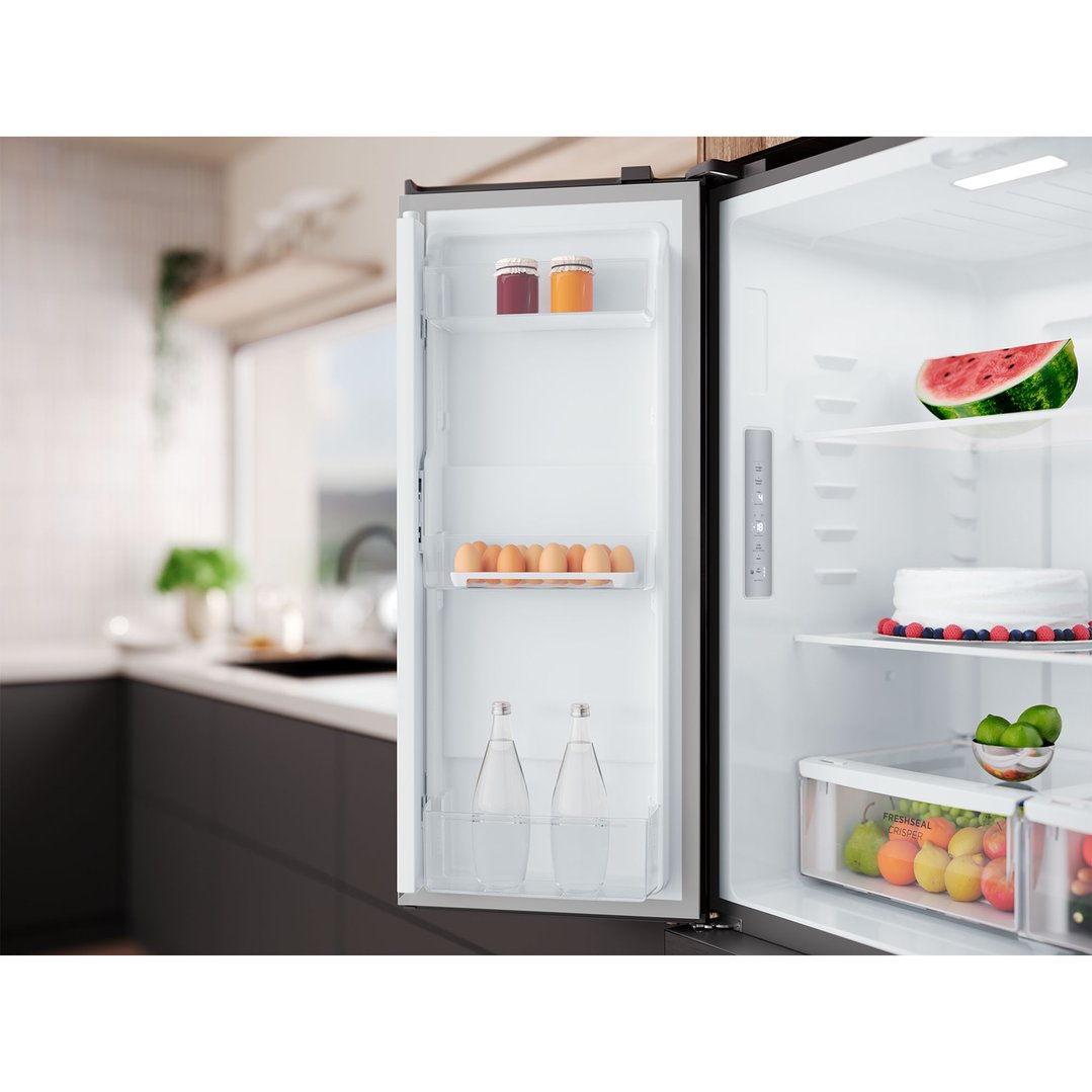 Open quad door fridge with food inside in a modern kitchen