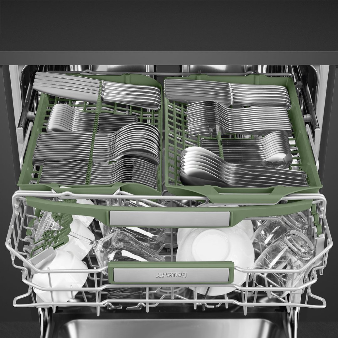 Close-up of a dishwasher interior with cutlery and dishes on racks