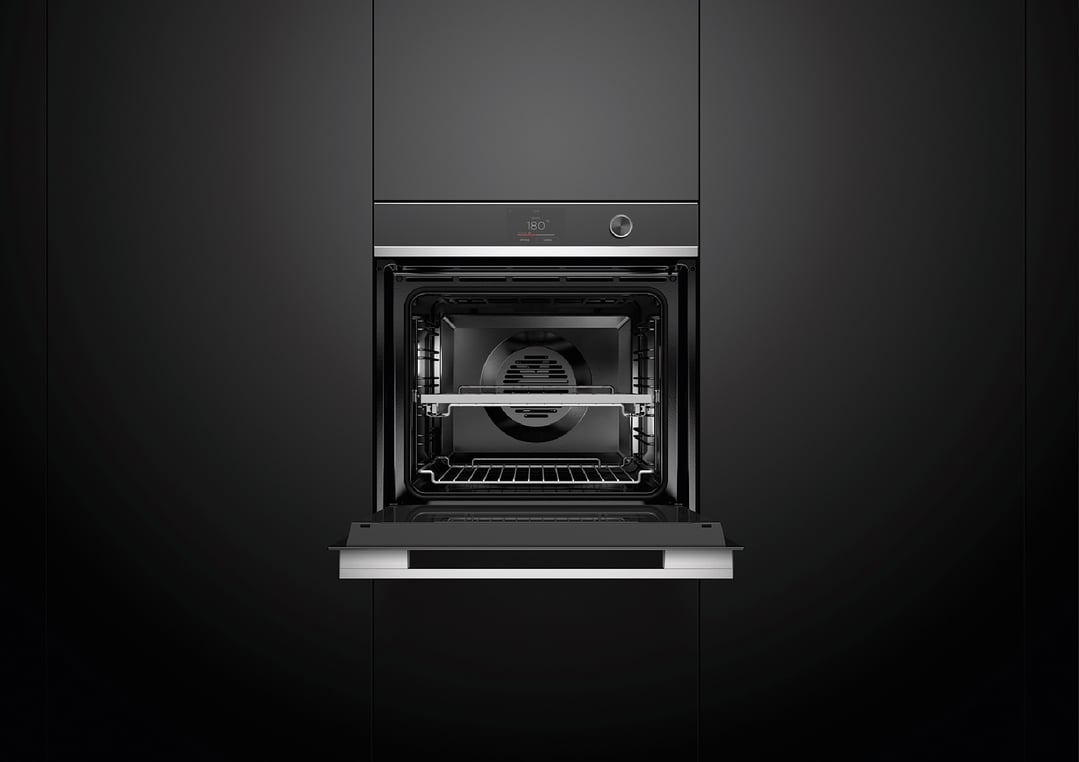 Built-in oven with the door open, showing the interior and racks