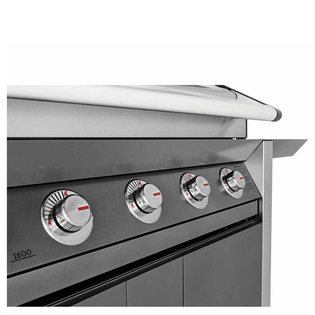 Close-up of the control panel and knobs of a stainless steel barbecue