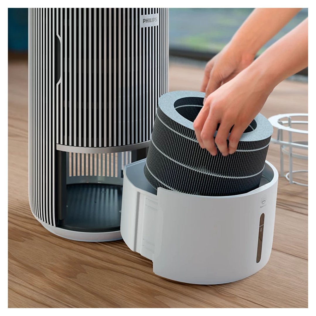 Hands inserting a new PureProtect Water Humidification Filter into a PHILIPS air purifier