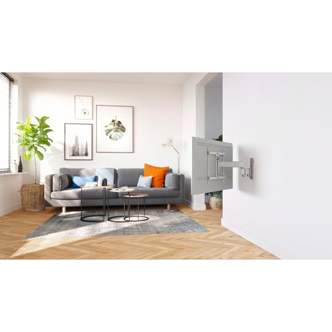 A TV wall mount extending from a white wall in a modern living room