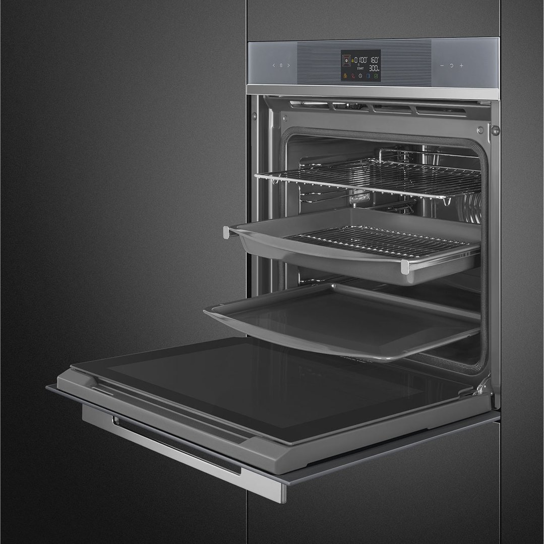 Built-in oven with door open, showing racks and trays inside