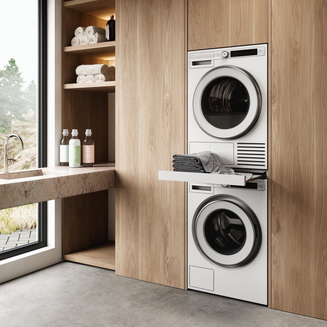 Laundry room with stacked washer and dryer, sink, and wooden shelving