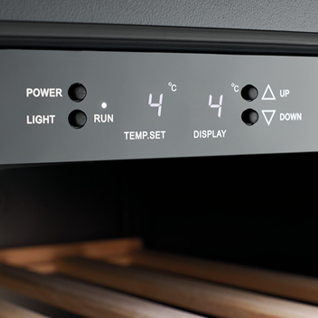 Close-up of the control panel on a wine cabinet, showing temperature settings
