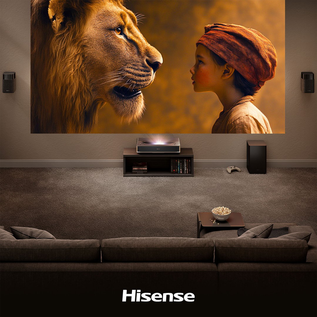 Projector displaying a movie scene in a living room with a sofa and popcorn