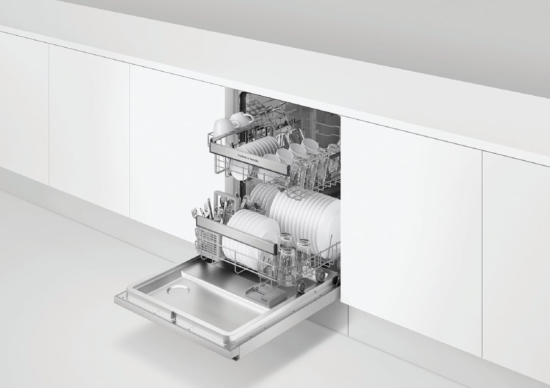 Built-under dishwasher with two racks of clean dishes and cutlery, partially open