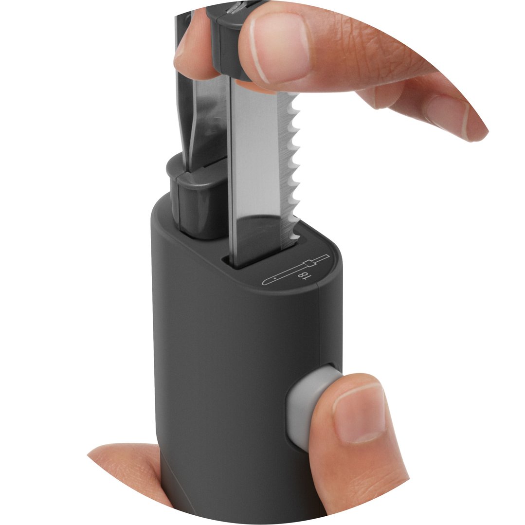 Hands inserting the blade into the Breville Slice n’ Carve™ Cordless Electric Knife