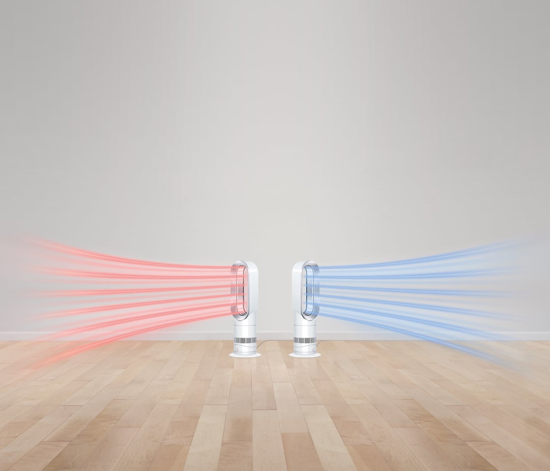 Two Dyson AM09 Hot+Cool Jet Focus fan heaters on a wooden floor