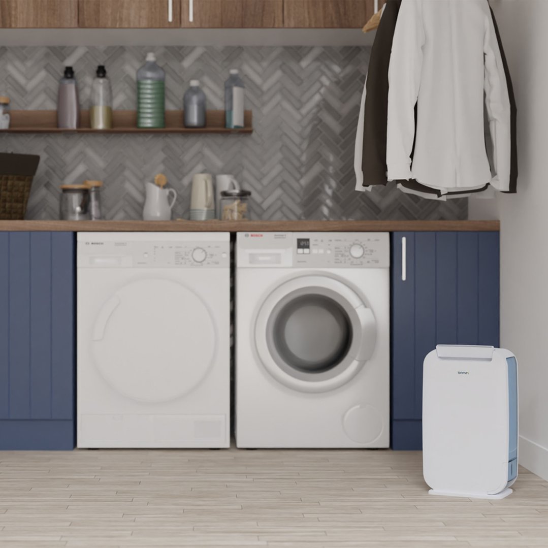 IONMAX 6L Zeolite Desiccant Dehumidifier in a laundry room with appliances