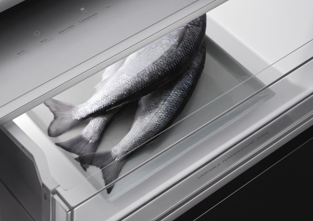 Three fish in the variable temperature zone of an integrated refrigerator freezer