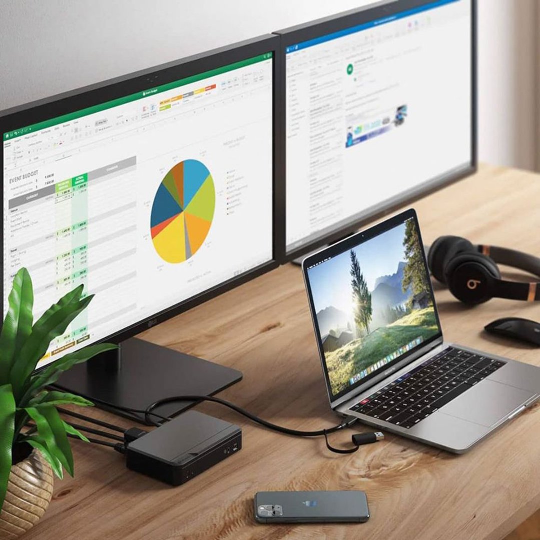 Universal Pro Docking Station connected to a laptop and two monitors on a desk