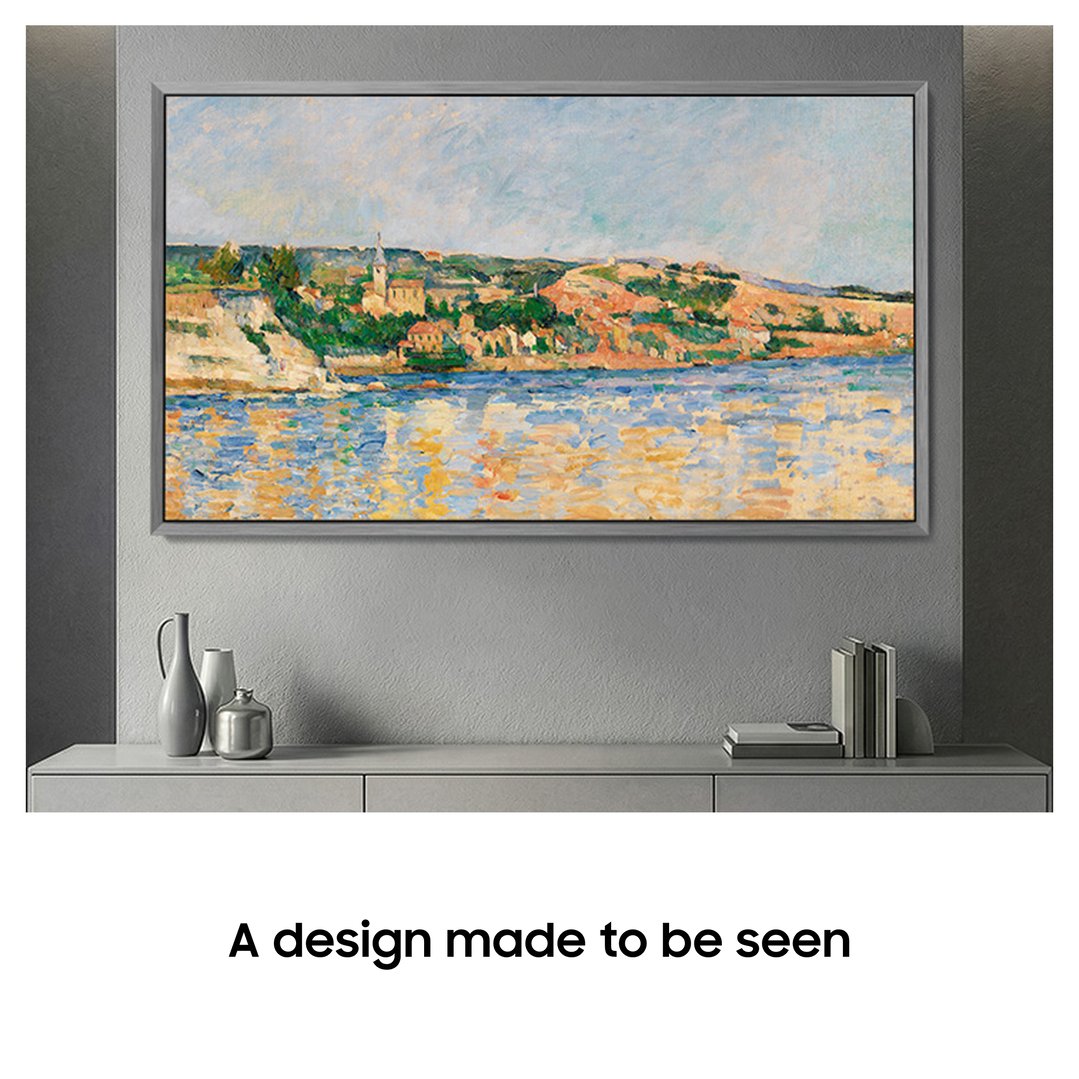 A TV displaying a painting of a coastal town, mounted on a grey wall