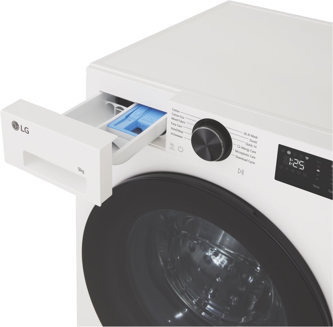Close-up of a white LG washing machine with the detergent drawer open