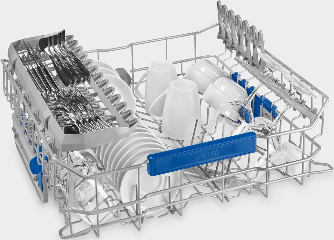 Close up of a dishwasher rack filled with dishes and cutlery