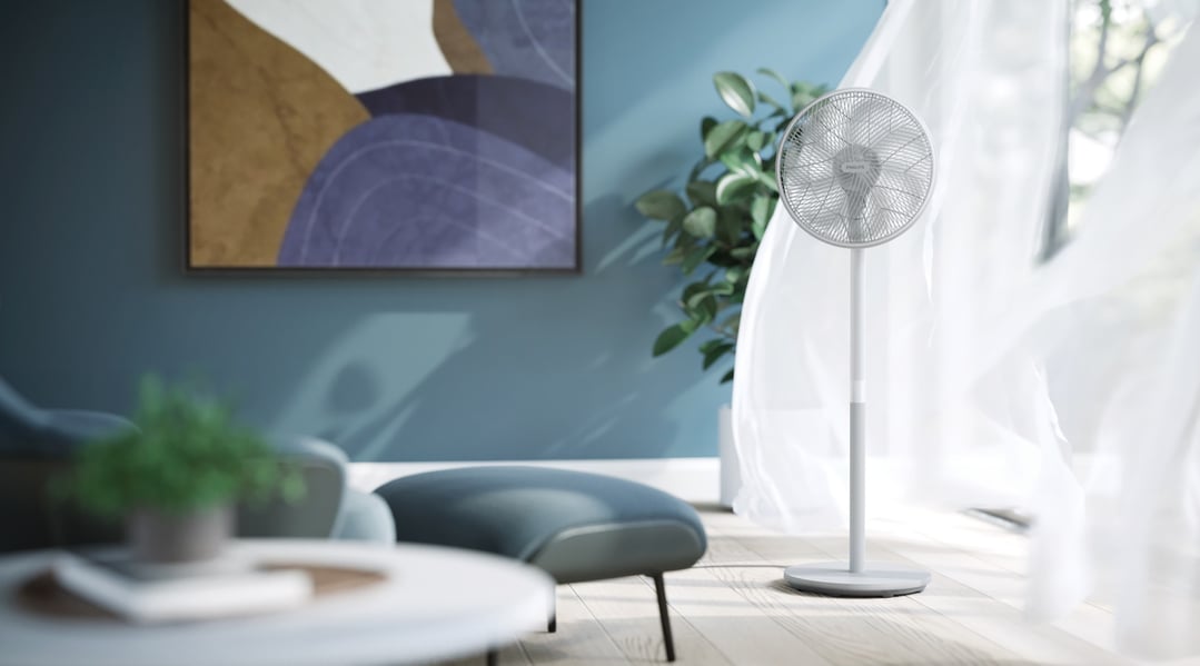 A white Philips Pedestal Fan 2000 Series in a modern living room