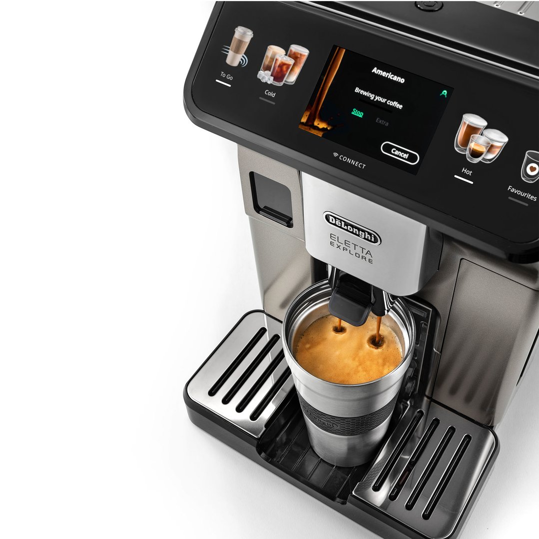 De'Longhi Eletta Explore coffee machine brewing coffee into a travel mug