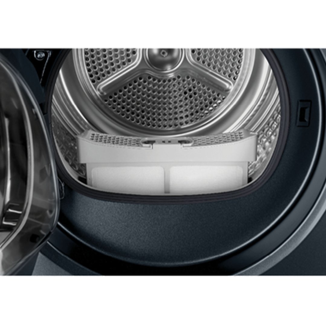 Close up of the open door and lint filter inside a washer dryer combo