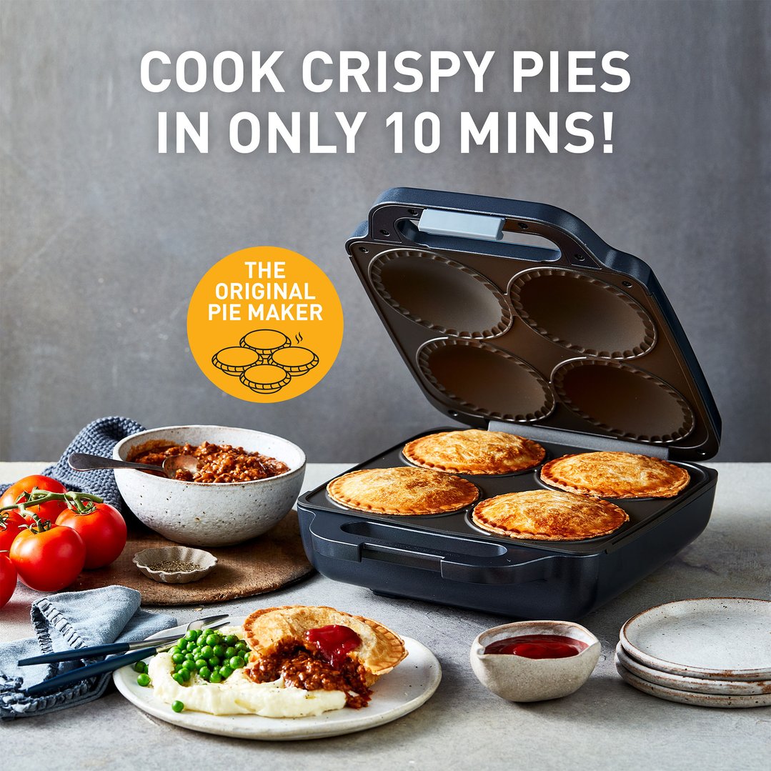 Sunbeam pie maker with four cooked pies, ingredients, and a plated pie