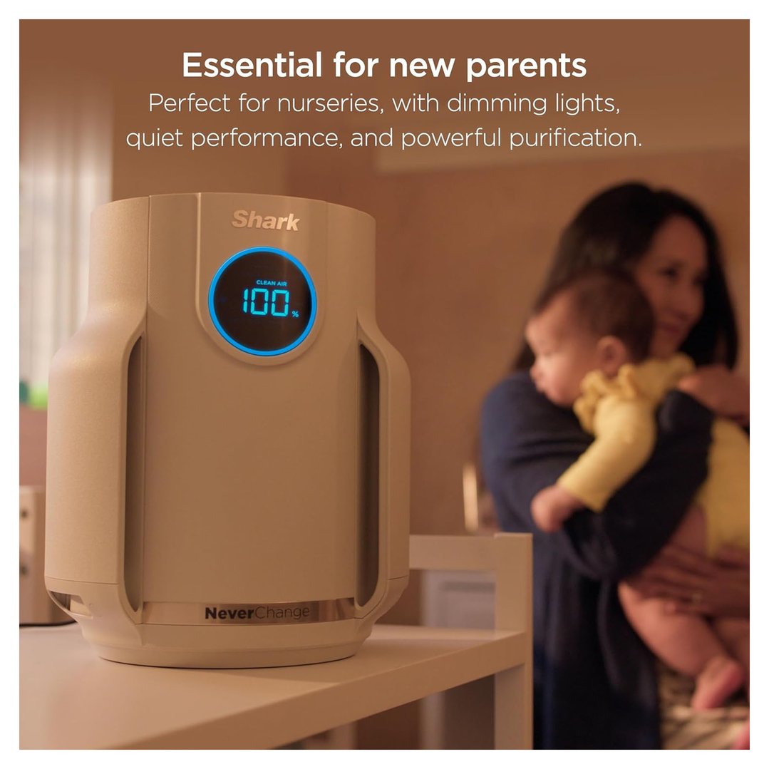Shark air purifier on a shelf with a mother holding a baby