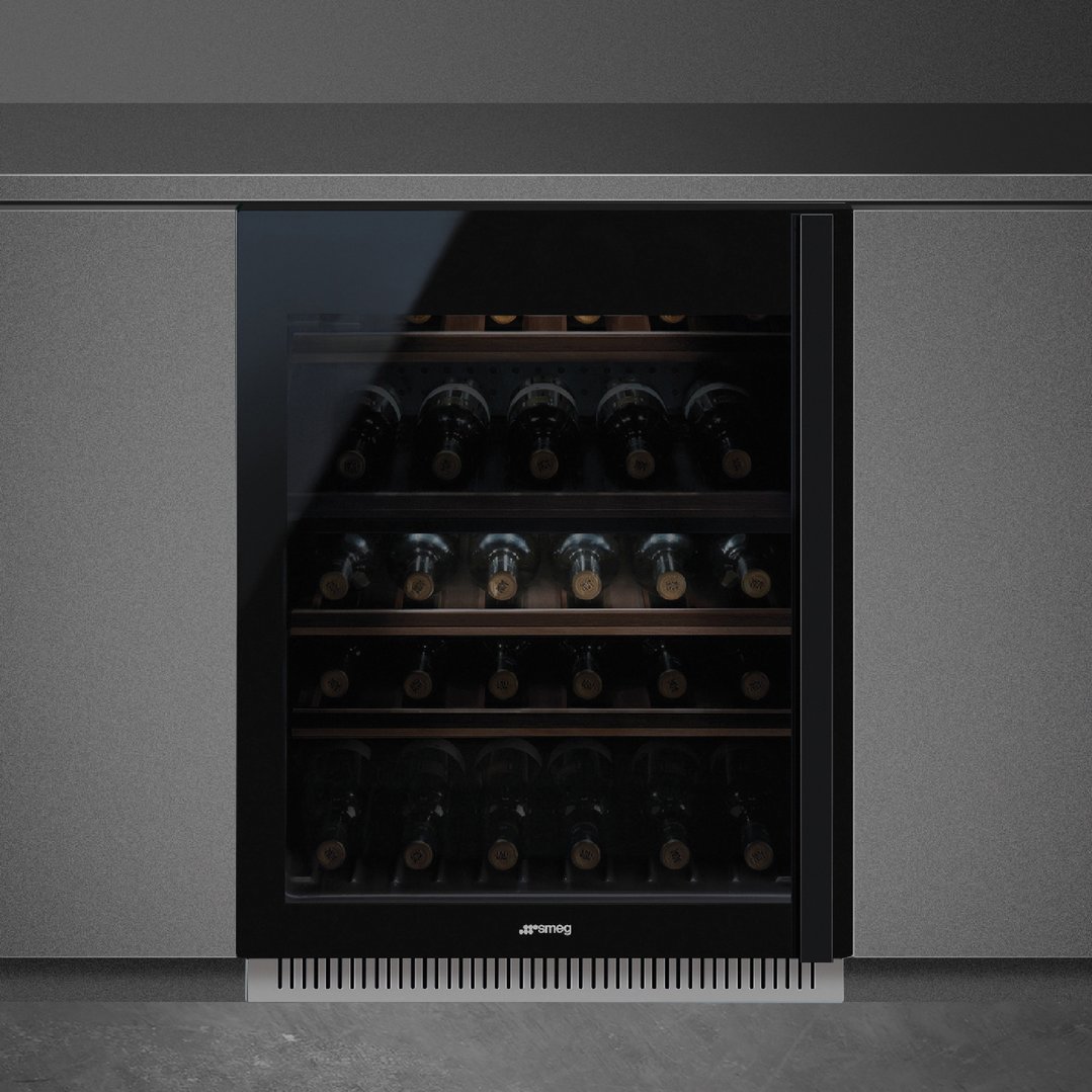 Built-in wine cooler with glass door and multiple shelves of wine bottles
