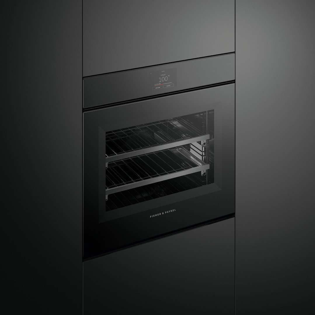 Black built-in oven with a digital display showing 100 degrees Celsius