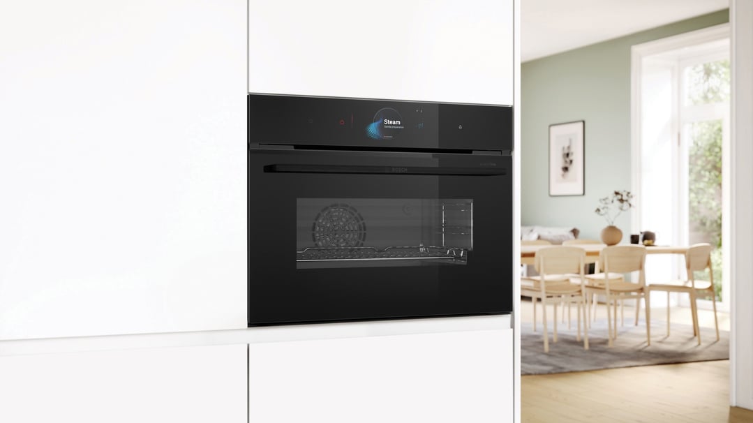Built-in compact oven with steam function in a modern kitchen setting