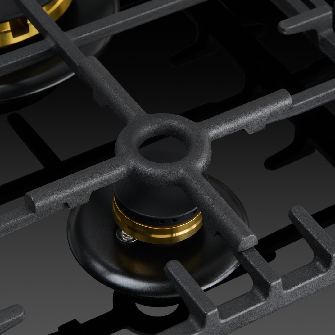 Close up of a gas on glass cooktop burner and grates