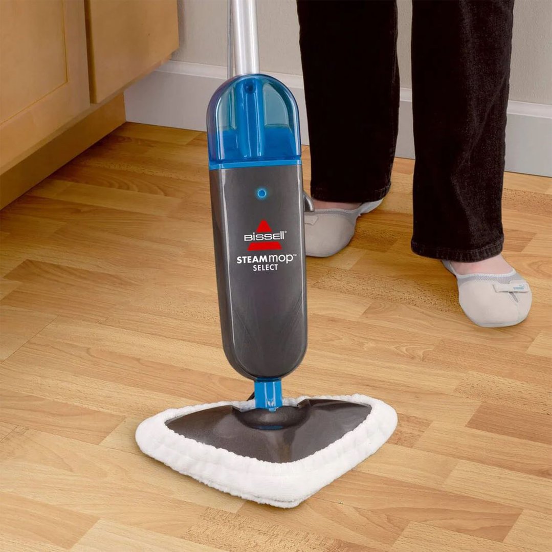 Person using a BISSELL Steam Mop Select on a wooden floor