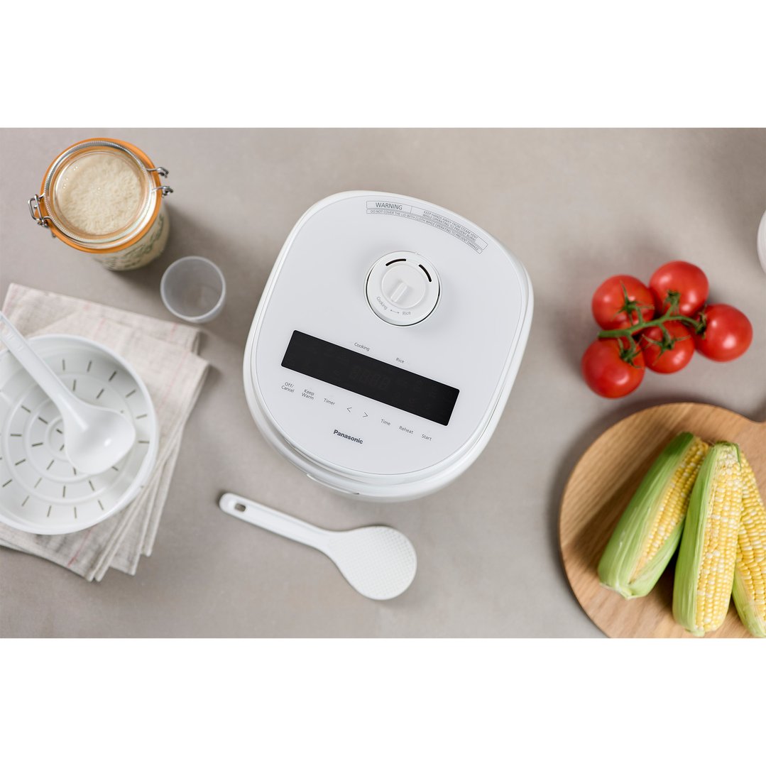 Overhead view of a Panasonic Rice & Multi Cooker with ingredients and accessories