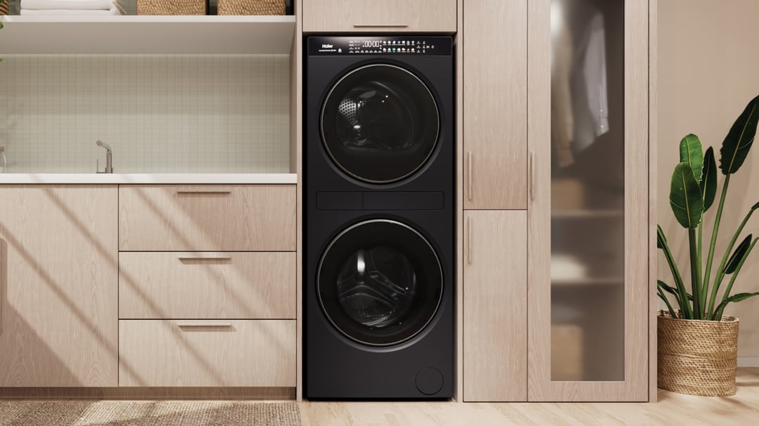 Haier washer dryer laundry centre in a modern laundry room with wooden cabinets