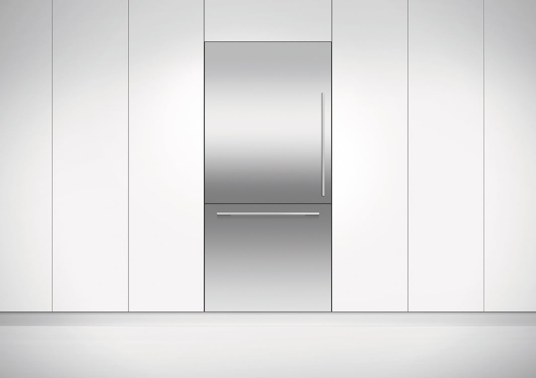 Integrated Refrigerator Freezer with stainless steel finish in a white kitchen setting