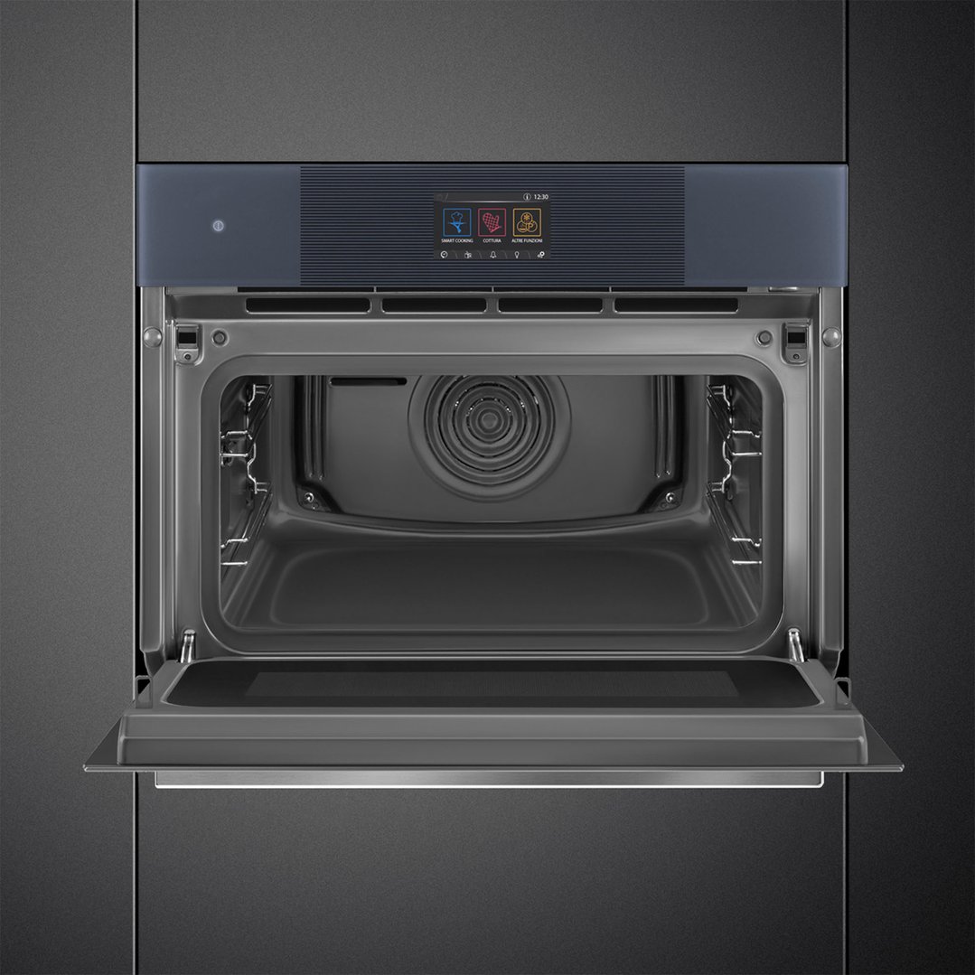 Built-in compact omnichef oven with door open, showing interior and control panel
