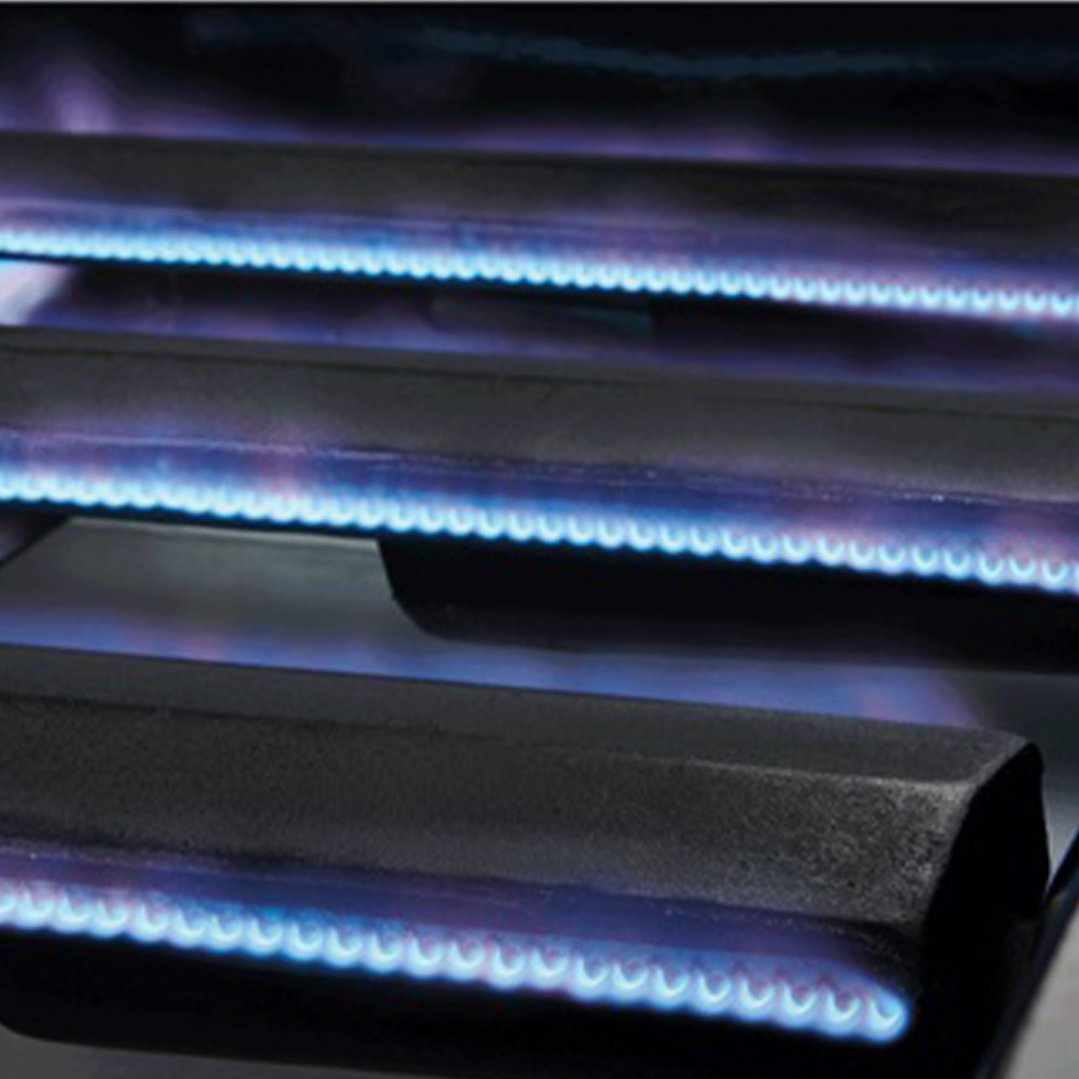 Close up of blue flames from a barbecue burner