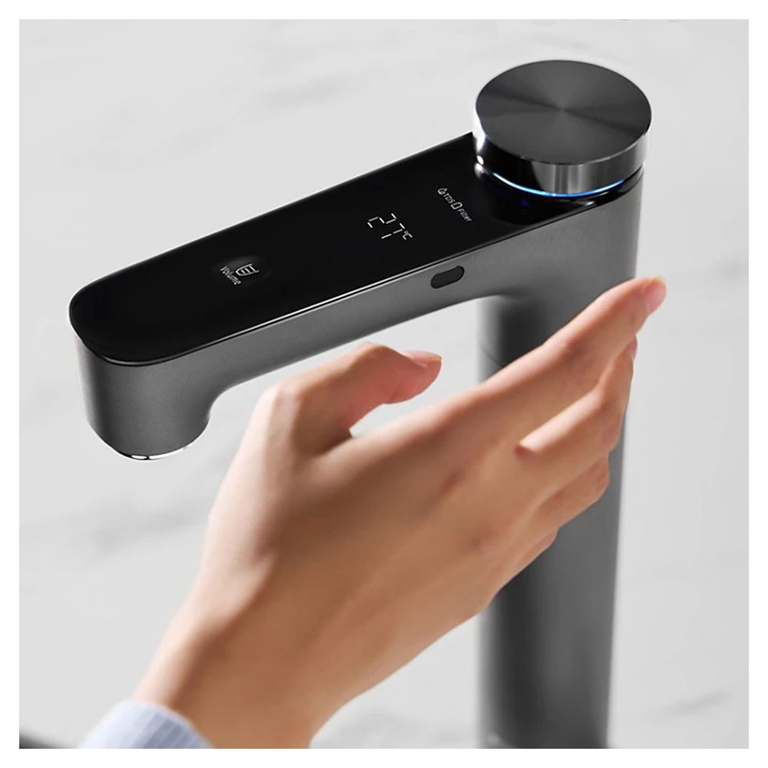 Hand interacting with a PHILIPS Reverse Osmosis purification purified chilled water tap station