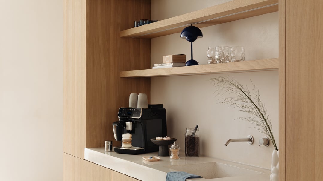 Series 4400 Fully Automatic Espresso Machine on a kitchen counter with accessories