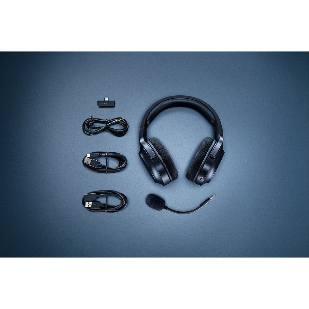 Razer Barracuda X Wireless Headset and accessories laid out on a dark blue surface