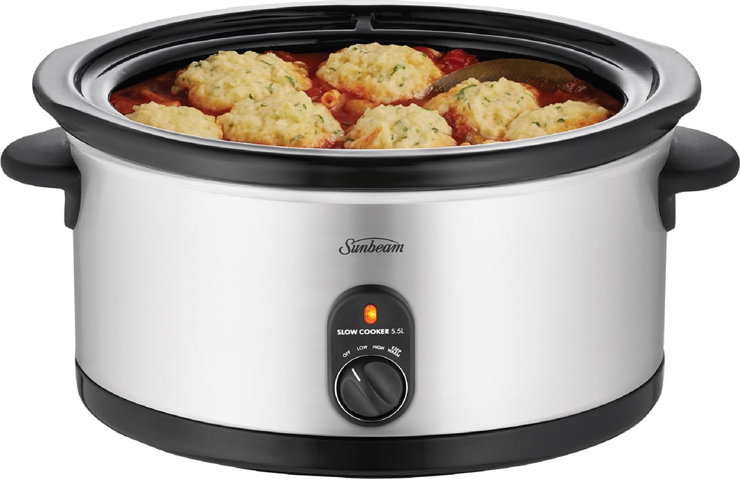 Slow cooker filled with food, on a white background