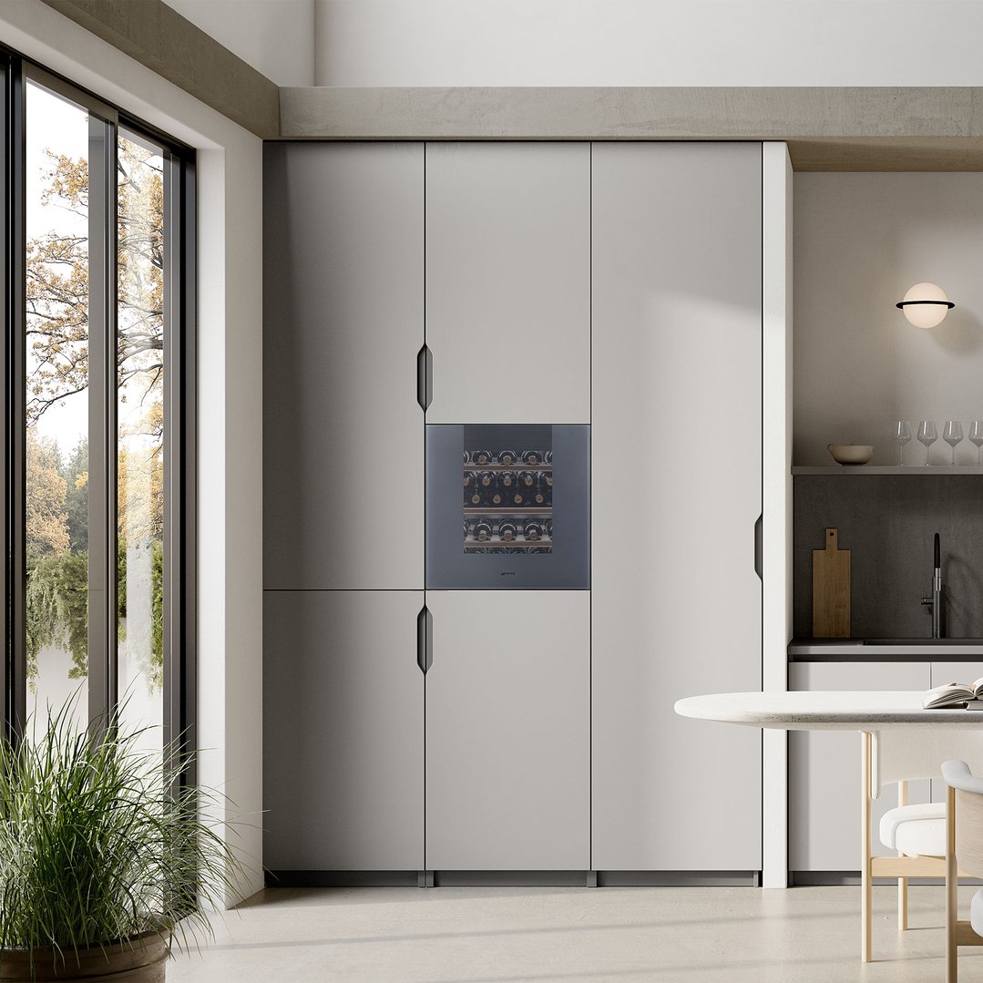 Built-in wine cellar in a modern kitchen with a large window and dining area