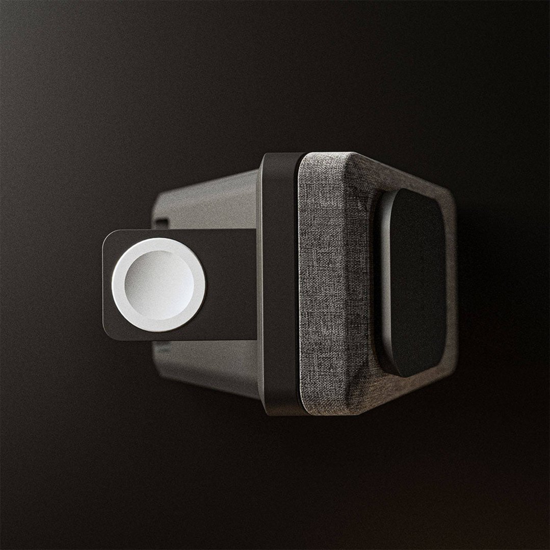 Close up of a black 3-in-1 charger with a fabric texture on a dark background