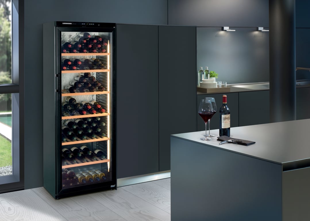 Liebherr wine cabinet in a modern kitchen setting with wine glasses and bottle