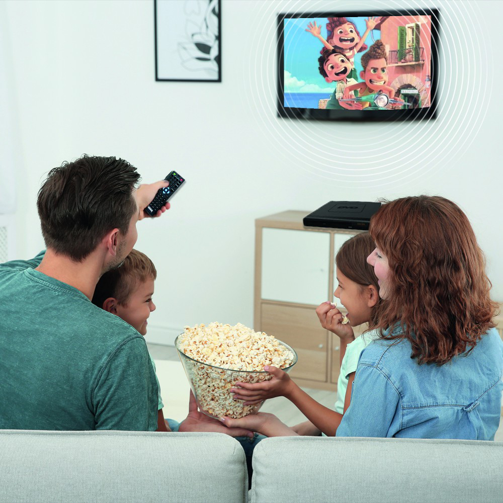 Family watching a movie on a TV with a DVD player in a living room